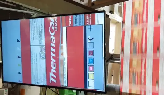 Engineer reviewing vision system design on operator interface